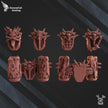 Set of game miniatures with detailed designs on a dark background, branded 'RavensTail Gaming'.