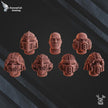 Set of game miniatures with detailed heads and helmets on a dark background, featuring the RavensTail Gaming logo.